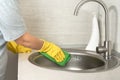 Cleaning service. woman gloves hands cleaning kitchen sink. Cleaning home table, sanitizing kitchen table, surface with Royalty Free Stock Photo