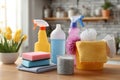 Cleaning set with products and tools on kitchen table Royalty Free Stock Photo