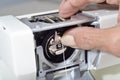 Cleaning sewing machine. Royalty Free Stock Photo