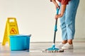 Cleaning, sign and woman mopping floor in office for hygiene, health and wellness. Spring cleaning, service and janitor