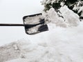 cleaning snow with a shovel outdoors Royalty Free Stock Photo