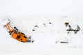 cleaning snow from the streets after a heavy snowfall. Tractor cleans the snow-view from the top