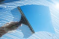 Cleaning soapy windows with squeegee against sunny blue sky. Spring house cleaning concept. Copy space Royalty Free Stock Photo