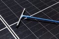 Cleaning Solar Panel concept, Sweeper dirty dust for power efficiency at solar panel surface tool Royalty Free Stock Photo