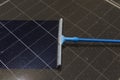 Cleaning Solar Panel concept, Sweeper dirty dust for power efficiency at solar panel surface tool Royalty Free Stock Photo