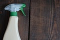 Cleaning solution on wooden background with copy space. Detergent spray