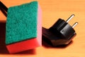 Cleaning sponge on wood background