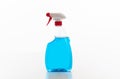 Cleaning spray bottle clear with blue color fluid isolated against white background