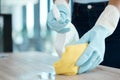 Cleaning, spray bottle and hygiene with woman with gloves for housekeeping, service or disinfectant on table surface Royalty Free Stock Photo