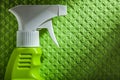 Cleaning sprayer on green dishrag Royalty Free Stock Photo