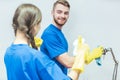 Cleaning squad dusting an office