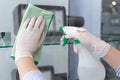 Cleaning staff operator injects alcohol and Use a cloth to wipe the window or glass, Cleaning windows with antiseptic or virus rem