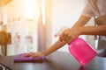 Cleaning staff is wiping cloth with cleaner and disinfectant on the surface of table to make the table clean with cleaning Royalty Free Stock Photo