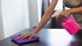 Cleaning staff is wiping cloth with cleaner and disinfectant on the surface of table to make the table clean with cleaning Royalty Free Stock Photo