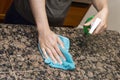 Cleaning Stone Counter-Top in Kitchen Royalty Free Stock Photo