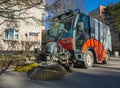 Cleaning streets of the city with the help of subcompact sweeper