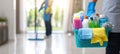 The cleaning supplies basket held by a worker in a bright home setting. AI generated image Royalty Free Stock Photo