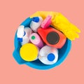 Cleaning supplies in blue bucket on pastel pink background Royalty Free Stock Photo