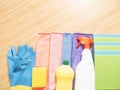 Cleaning supplies with blue oranges pink green white spray yellow cleaner brush and blue gloves Royalty Free Stock Photo