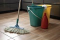 cleaning supplies, including mop and bucket for a clean and tidy house