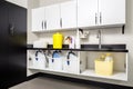 cleaning supplies in sleek, modern storage unit Royalty Free Stock Photo