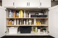 cleaning supplies in a sleek and organized storage unit Royalty Free Stock Photo