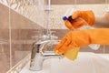 Cleaning tap from limescale in bathroom, disinfecting surface from contamination