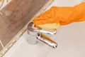 Cleaning tap from limescale bathroom sink close-up Royalty Free Stock Photo