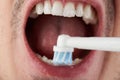 Cleaning teeth with electrical brush Royalty Free Stock Photo