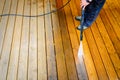 Cleaning terrace with a power washer - high water pressure clean Royalty Free Stock Photo