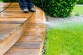 Cleaning terrace with a power washer - high water pressure clean Royalty Free Stock Photo