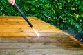 cleaning terrace with a power washer - high water pressure clean Royalty Free Stock Photo