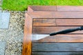 Cleaning terrace with a power washer - high water pressure cleaner on wooden terrace surface Royalty Free Stock Photo