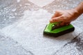 Cleaning the tiled floor with a plastic floor scrubber Royalty Free Stock Photo