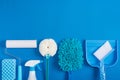 Cleaning tools blue background Royalty Free Stock Photo