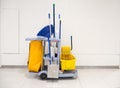 Cleaning tools cart wait for cleaning.Bucket and set of cleaning equipment in the office and Department store Royalty Free Stock Photo