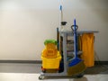 Cleaning tools cart wait for cleaner. Bucket and set of cleaning equipment in the Department store. janitor service janitorial for Royalty Free Stock Photo