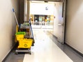 Cleaning tools cart wait for maid or cleaner in the department store. Bucket and set of cleaning equipment in the mall. Concept of Royalty Free Stock Photo