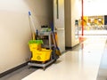 Cleaning tools cart wait for maid or cleaner in the department store. Bucket and set of cleaning equipment in the mall. Concept of