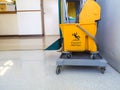 Cleaning tools cart wait for maid or cleaner in the hospital. The warning signs cleaning in process the floor in building. Bucket Royalty Free Stock Photo