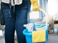 Cleaning tools, living room and maid hands of a woman in a house with chemical spray in basket. Home, cleaner and house Royalty Free Stock Photo