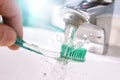 Daily cleaning of the toothbrush after use in sink detail Royalty Free Stock Photo