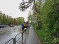 Cleaning traffic signs on city street in chelyabinsk, russia