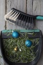 Cleaning up after christmas. Sweeping up pine needles and broken decorations Royalty Free Stock Photo