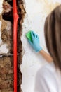 Cleaning up dangerous fungus from a wet wall after water pipe leak Royalty Free Stock Photo