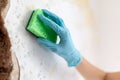 Cleaning up dangerous fungus from a wet wall after water pipe leak Royalty Free Stock Photo