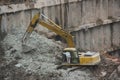 Are cleaning up the dirt of the excavator at the SHENZHEN construction site