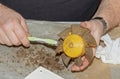 Cleaning a very dirty kitchen exhaust fan from dirt with a brush. A man cleans the parts of a fan with a brush