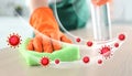 Cleaning vs viruses. Woman washing table with sponge and disinfecting Royalty Free Stock Photo