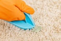 Cleaning white carpet pile from chewing gum Royalty Free Stock Photo